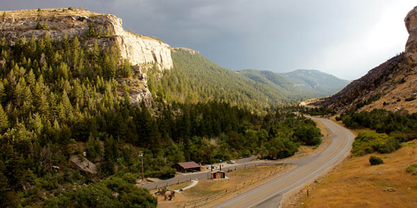 Sinks Canyon State Park mountain with pine trees and road going through