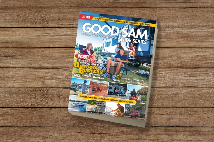 Good Sam Guide Series camping & RVing book on wooden table