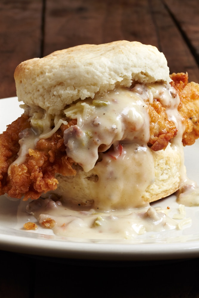 Pimento cheese biscuit with chicken and gravy on plate
