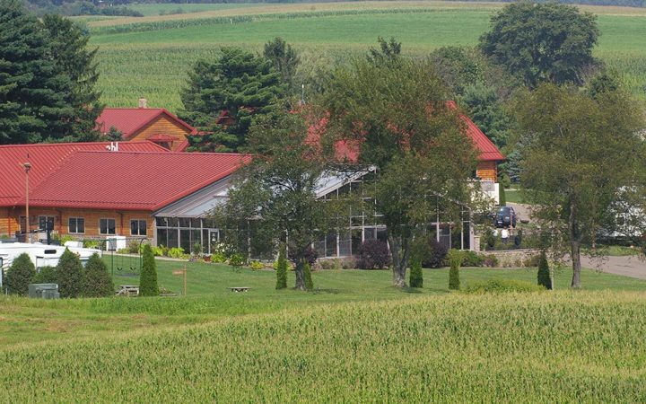 Red barn in rolling green hills