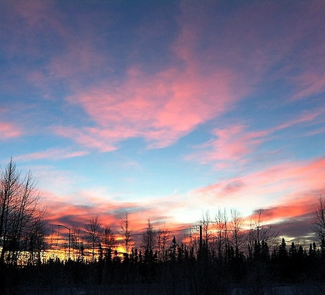 Beautiful pink and blue sunset at River's Edge RV Park in Alaska