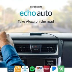 Amazon Alexa Auto unit sitting on top of dash board inside of a vehicle.