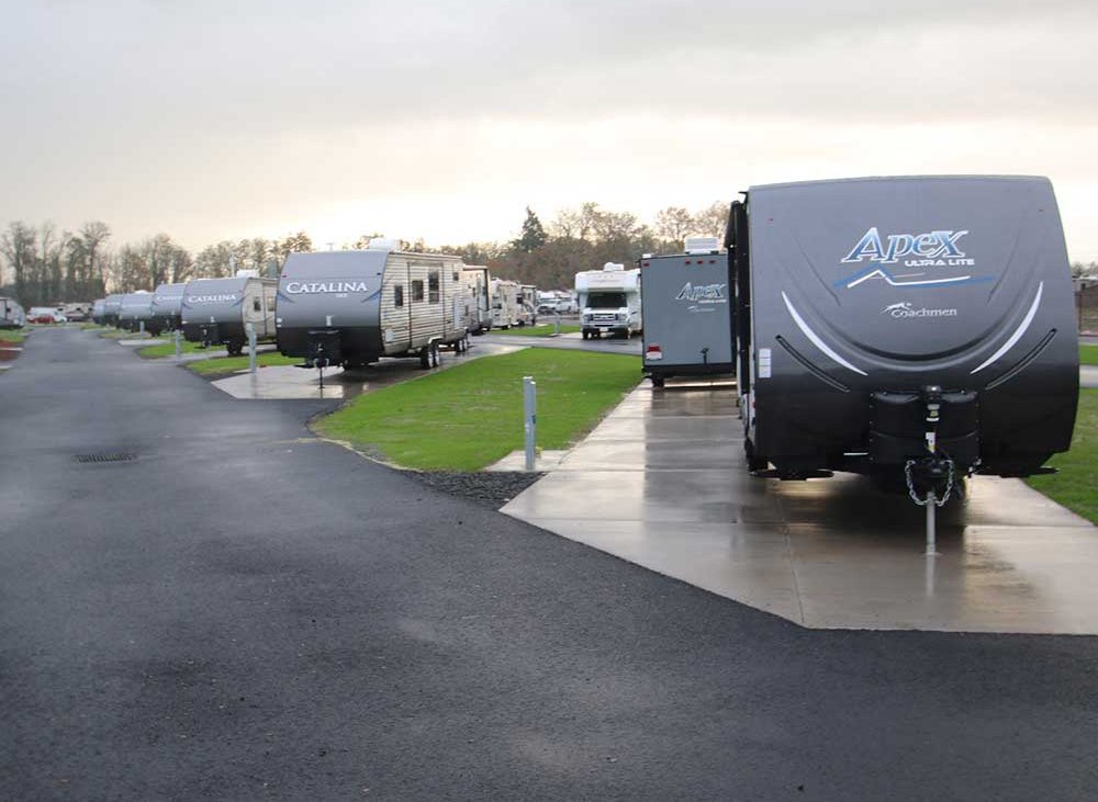 Multiple towables parked in RV spots at Guaranty RV Park