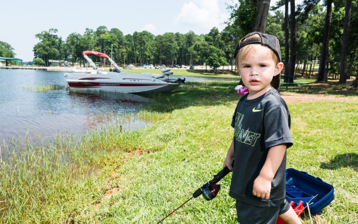 Young boy fishing during the day at Toledo Lake Louisiana