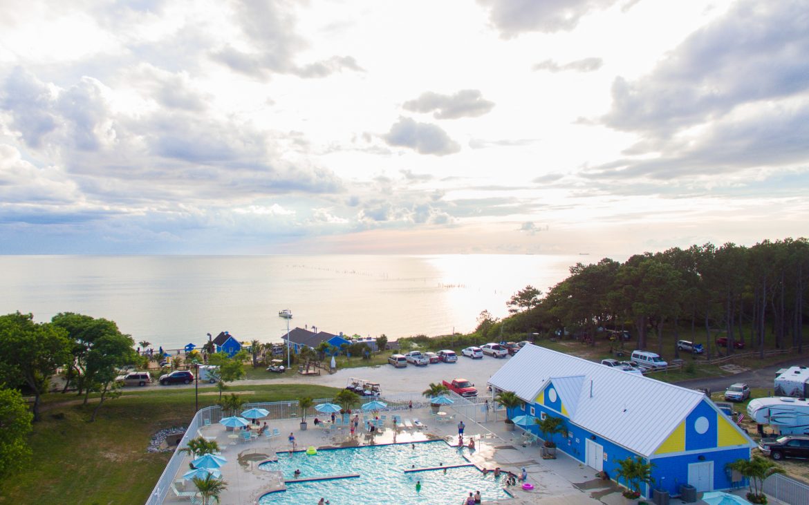Gorgeous arial view of community pool with sunset in background
