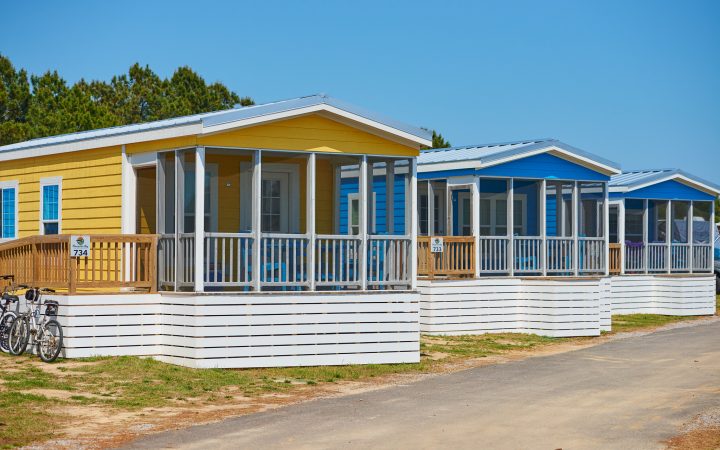 Brightly colored rental cabins lined along road