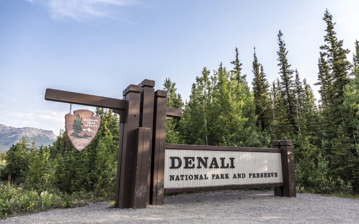 The park main entrance sign that welcomes tourists to Denali National Park and Preserve in Alaska, USA.
