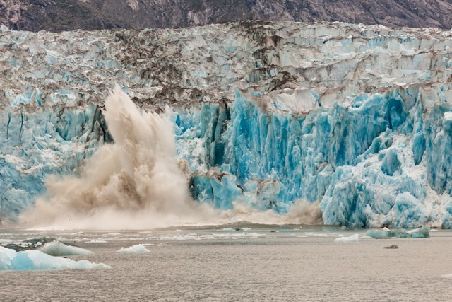 Blue tinted glacier on freezing water