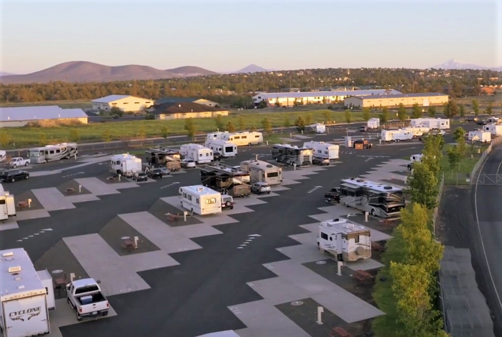 Aerial view of campground showing many RVs and trailers