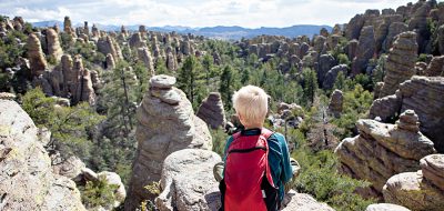 A child enjoying the view of hoodoo formations at Chiricahua National Monument.