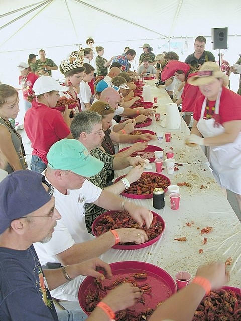 Large group of people eating crawfish at festival