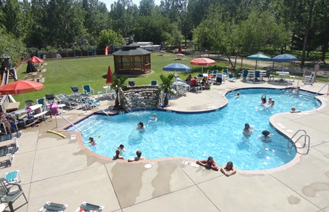Aerial view of community pool with campers swimming