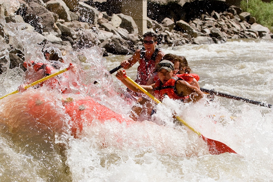 Rafters navigate the rapids in Glen Canyon, Colorado.