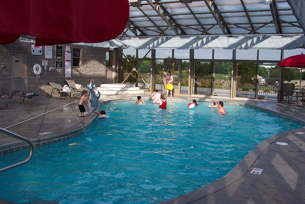 Group of people playing in indoor community pool