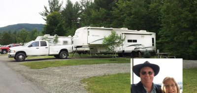 White truck and trailer attached with thumbnail of couple in corner of picture