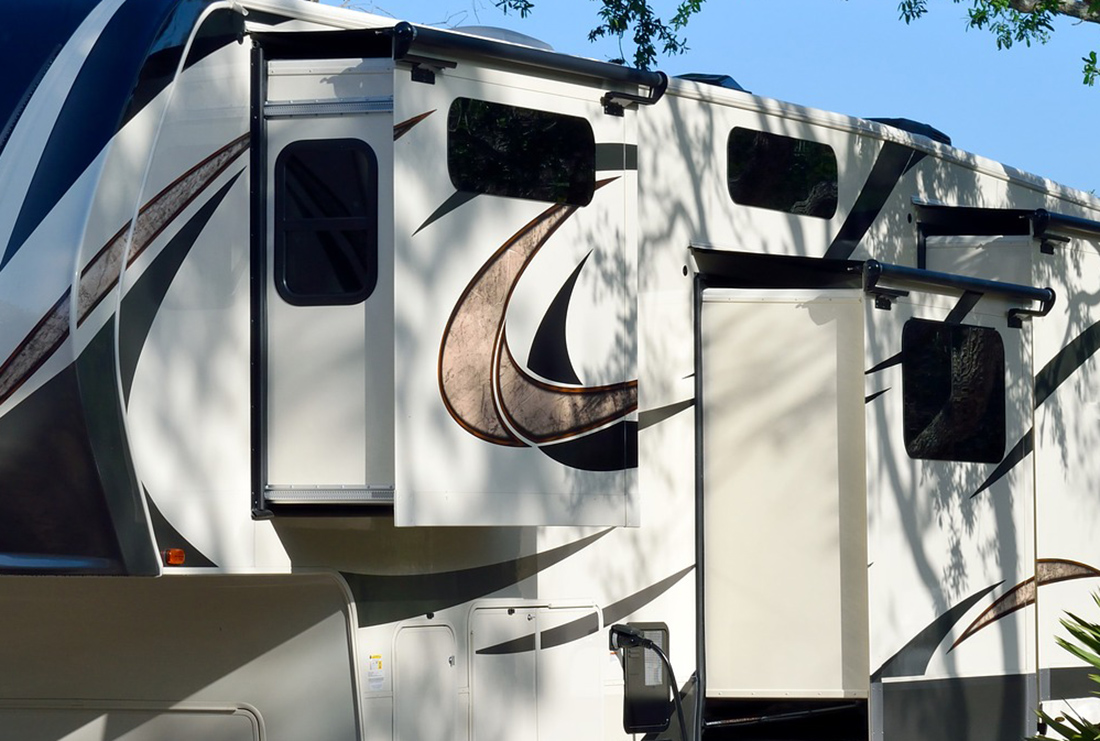 Slide-outs deployed on a fifth-wheel trailer. 
