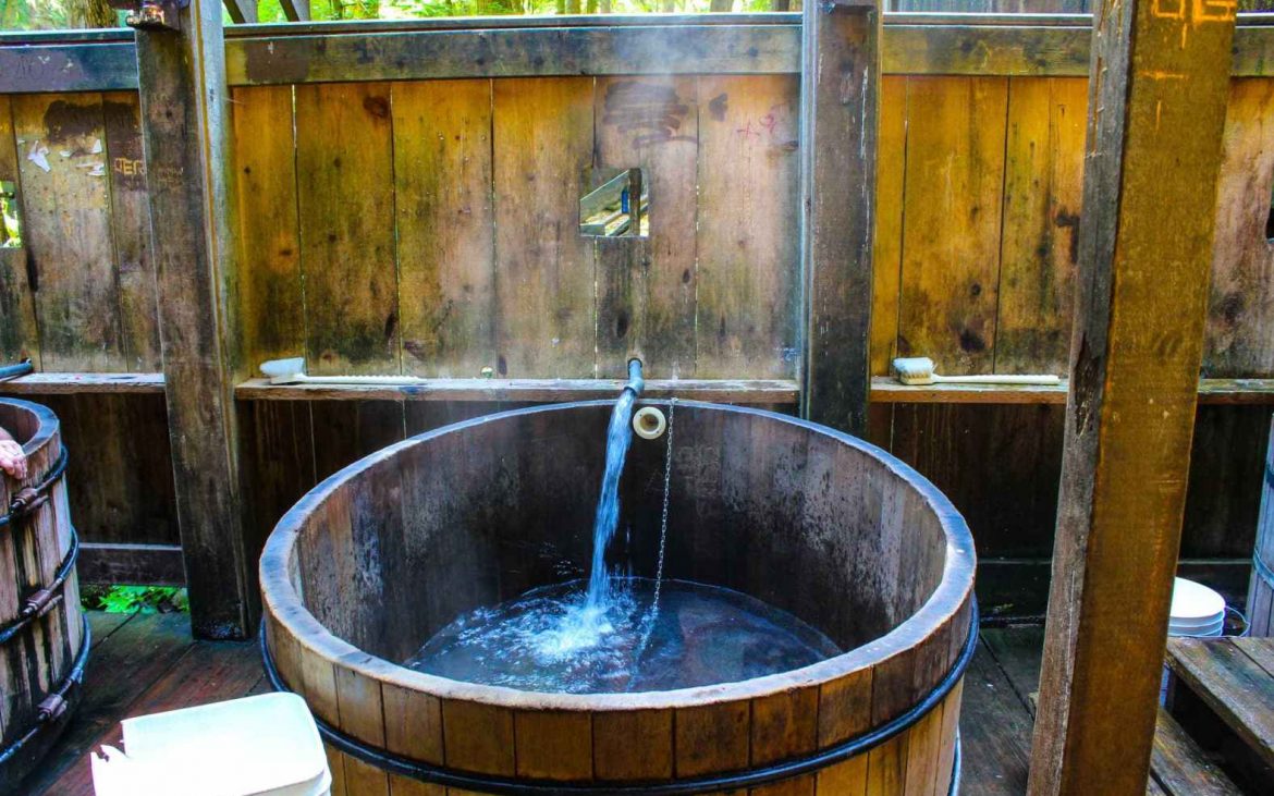 Wooden wine barrel with stream of water