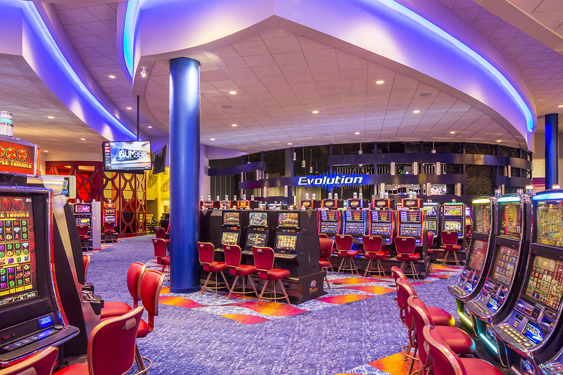 Slot machines arrayed on the casino floor.