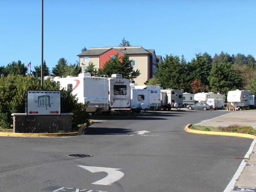 RVs at their sites amid tall, treen trees in Logan Road RV Park in Oregon.