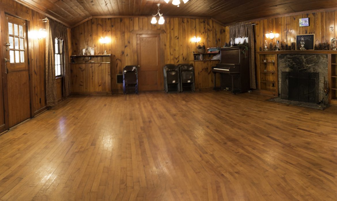 Interior of wide open wooden accented community room