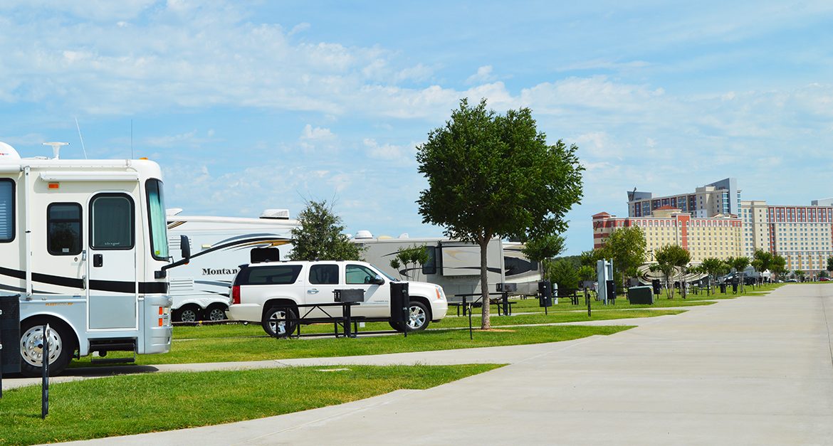 RVs parked in concrete lots with the Winstar Casino in the background.