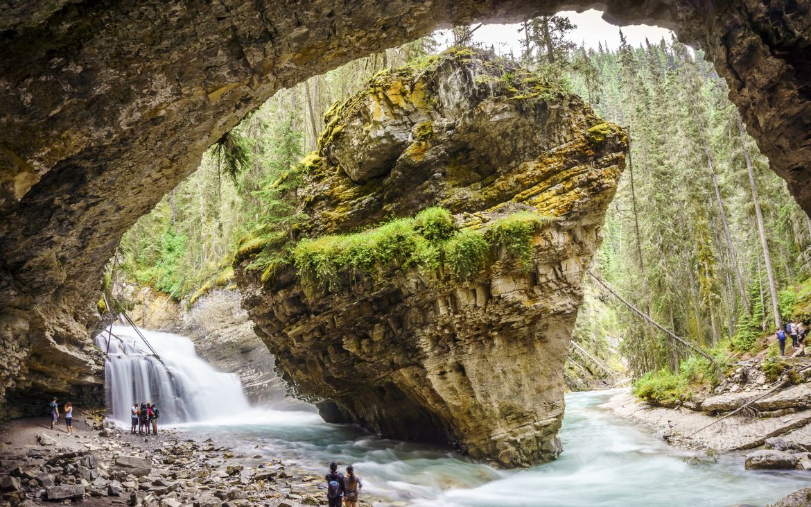 Massive rock and neighboring waterfalls in Banff