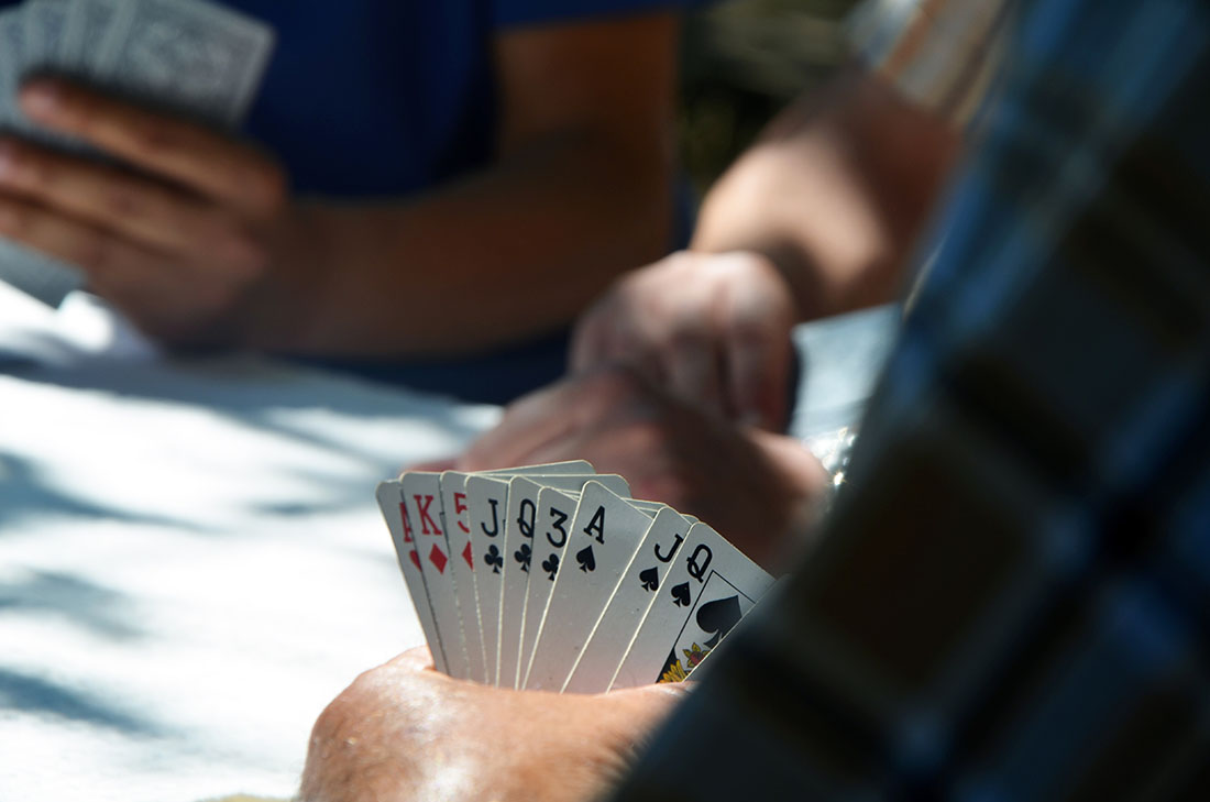 Looking at a hand of cards during a poker game.