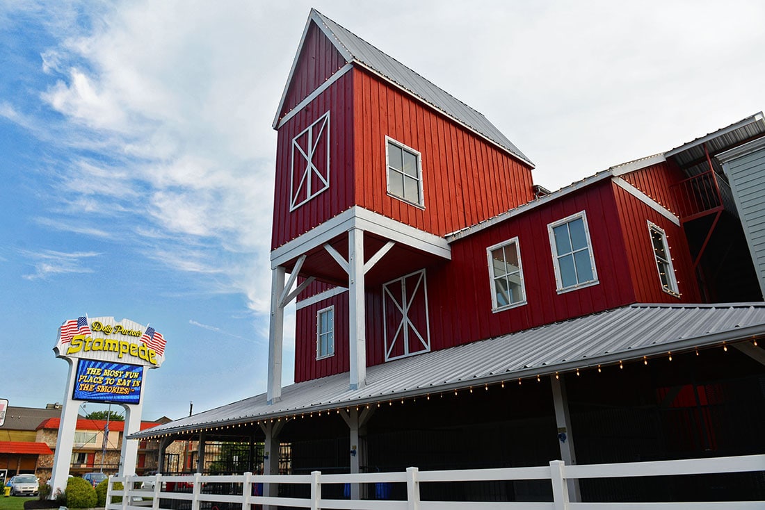 Barn-like structure with the "Dolly Parton Stampede" sign out front.