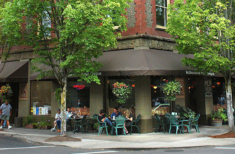 Diners relaxing at a street corner.