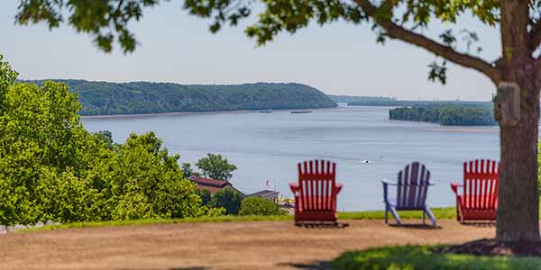 Adirondack chairs sitting lakeside