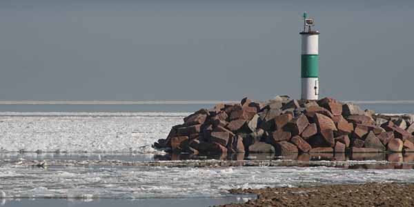 A close-up look at a navigation light on a jetty.