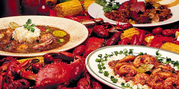Shrimp, crawfish and gumbo laden on a plate.