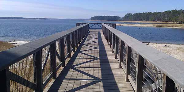 A wooden walkway leading to an observation deck.