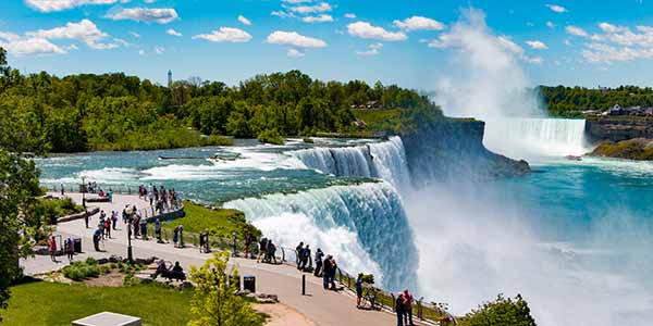 Niagara falls with visitors overlooking the falls