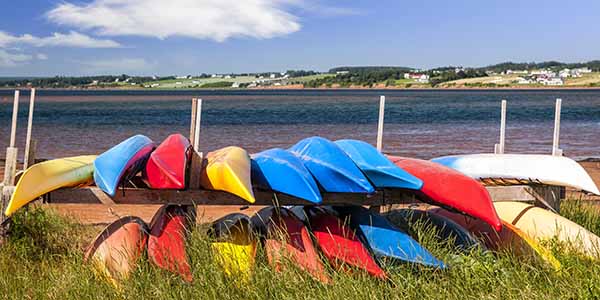 Colorful kayaks stored on Atlantic shore
