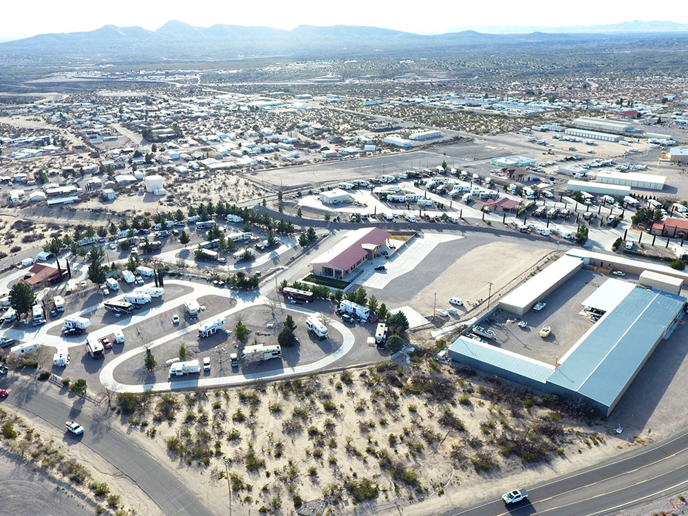 An aerial shot of an RV park with surrounding town.