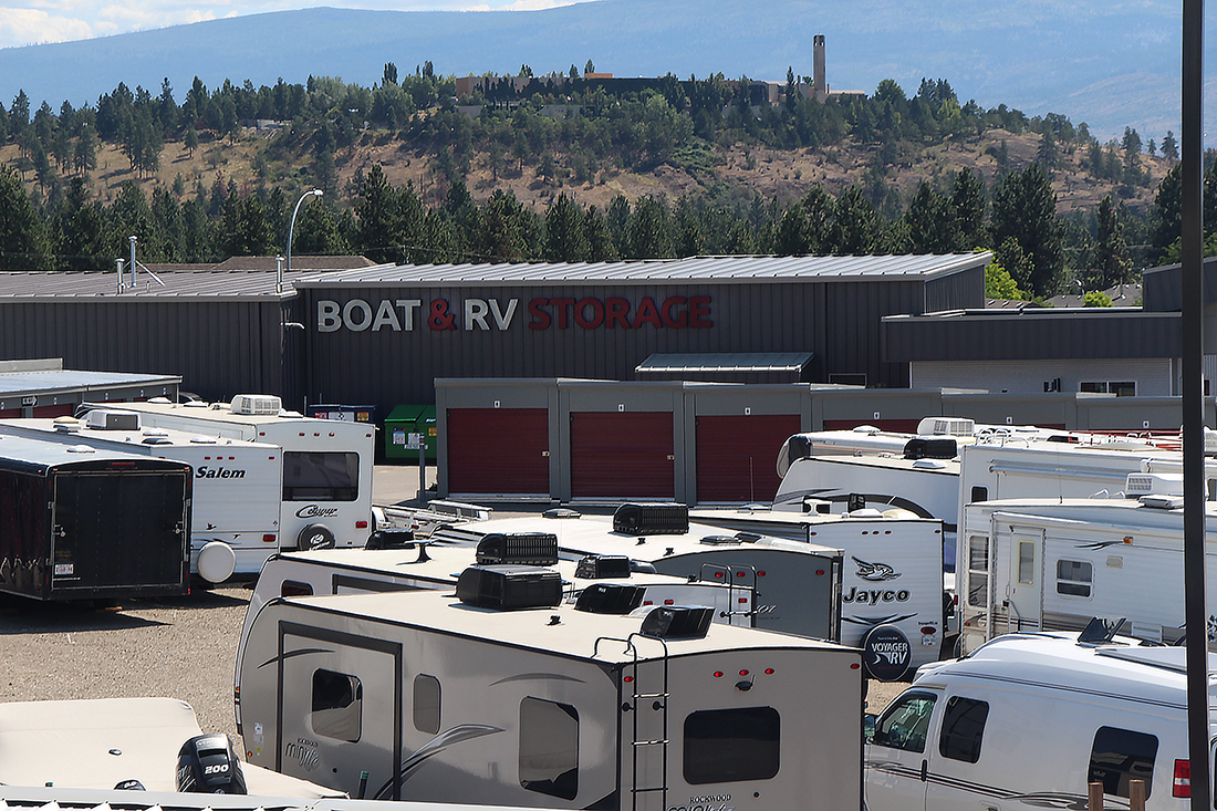 Trailers and motorhomes in an RV & Boat Storage yard.