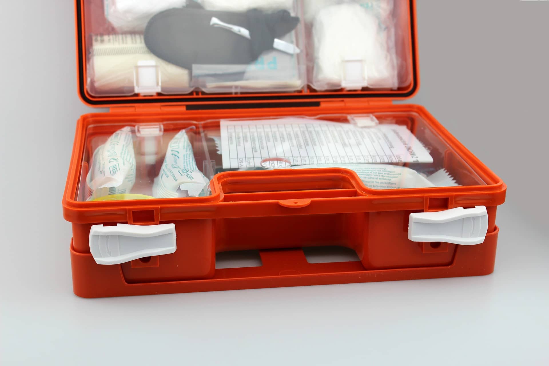 A first-aid kit open to reveal its contents.