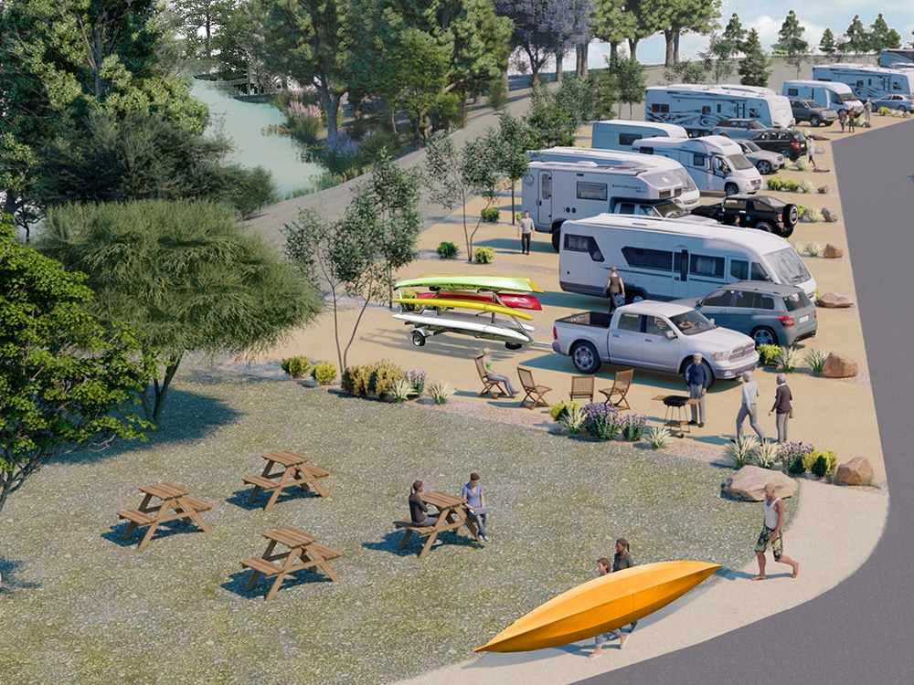 RVs parked in a row as guests — one with a kayak — stroll for the Verde River in the background.