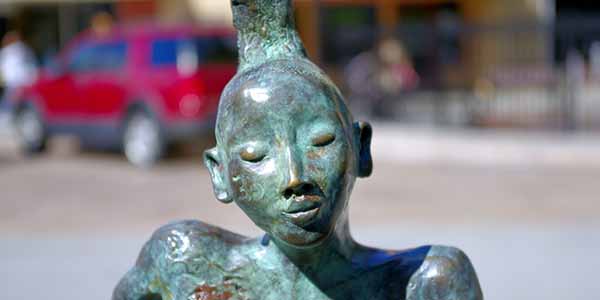 Bronze sculpture of a Native American girl