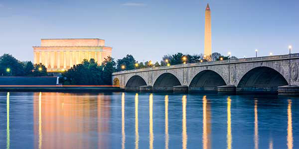 The Washington Monument and Lincoln Memorial tower over the Potomac River. 