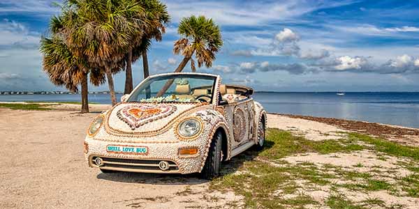 A VW bug covered in shells