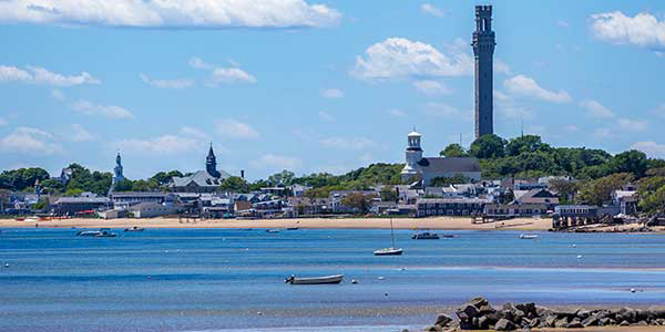 A tranquil bay with large tower jutting out of the horizon.