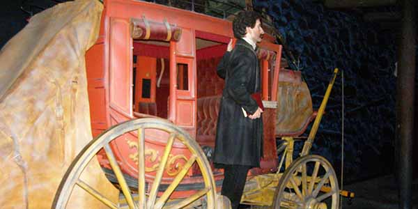 A figure of a man on a stagecoach in the museum