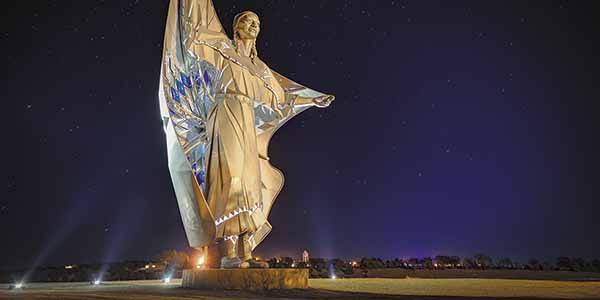 The 50-foot-tall Dignity sculpture overlooks the Missouri River.