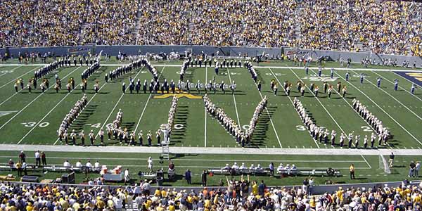The marching band standing spelling out West Virginia University