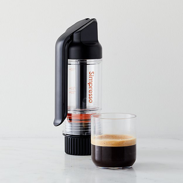 A simpresso portable Espresso maker with cup of foamy espresso