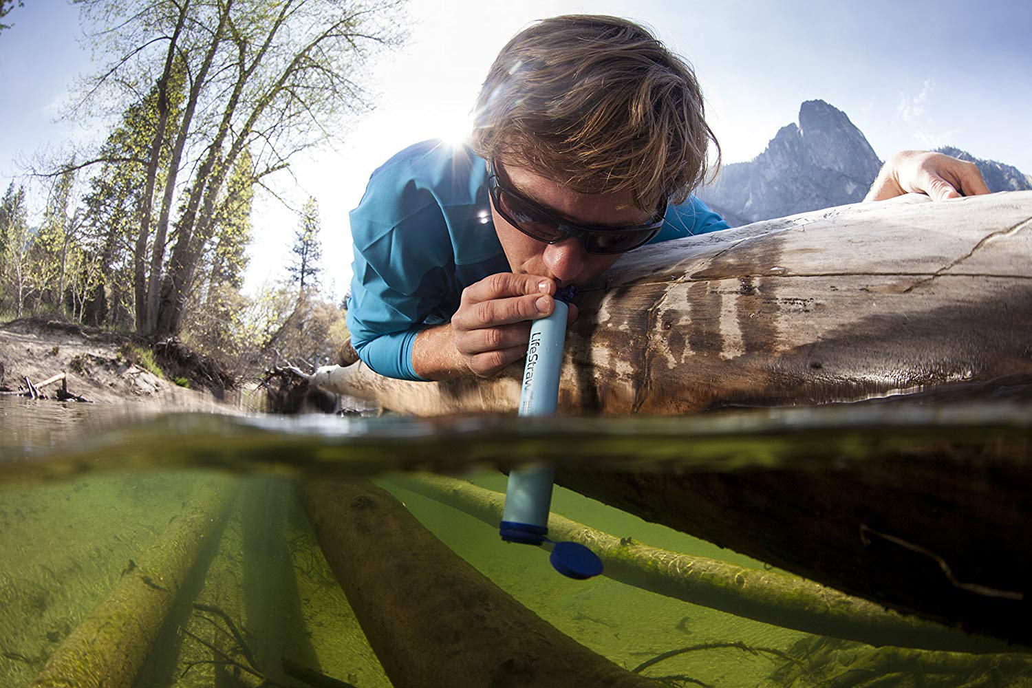 Dude drinking bad water from a stream