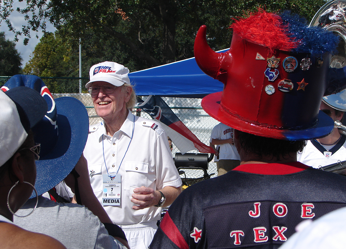 Fans in Houstan Texan regalia attend a tailgating party.