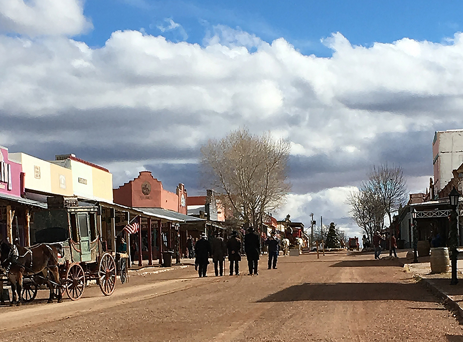 A gunfight reenactment on a dusty Old West Road